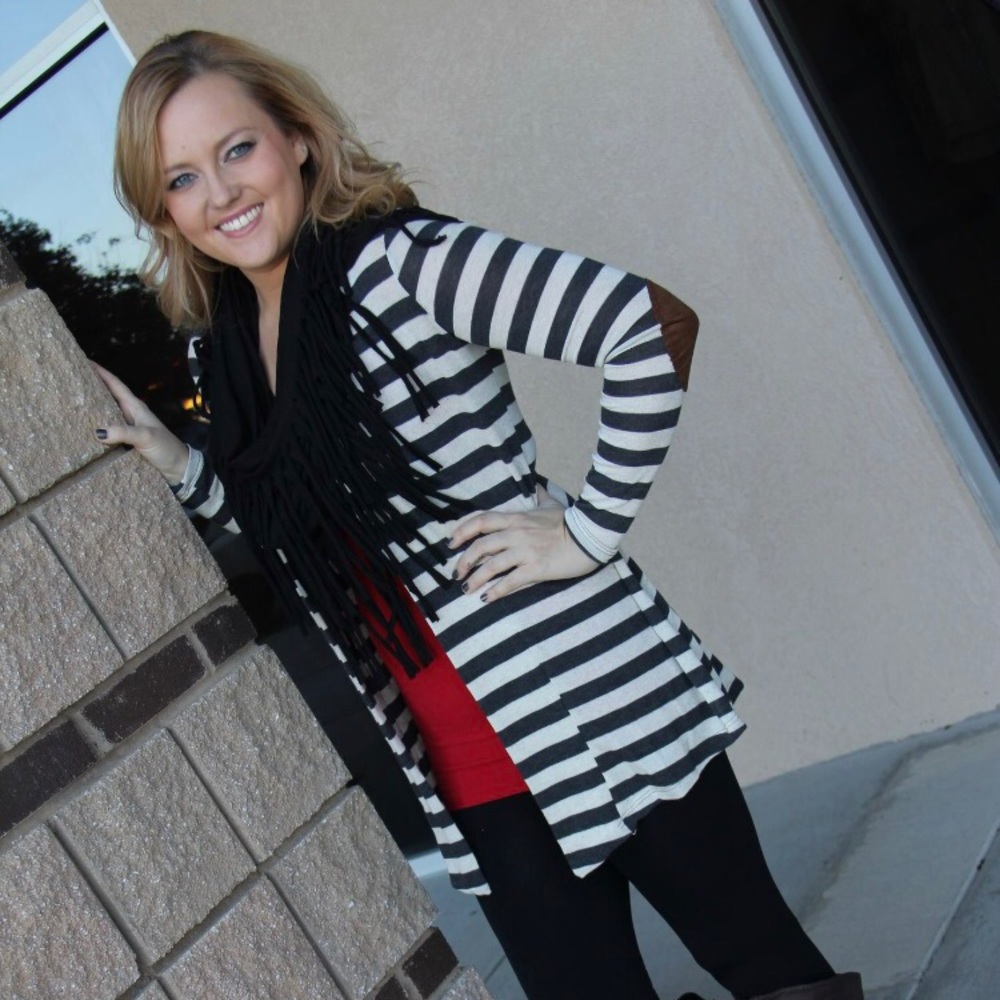 Black and cream cardigan with brown elbow patches